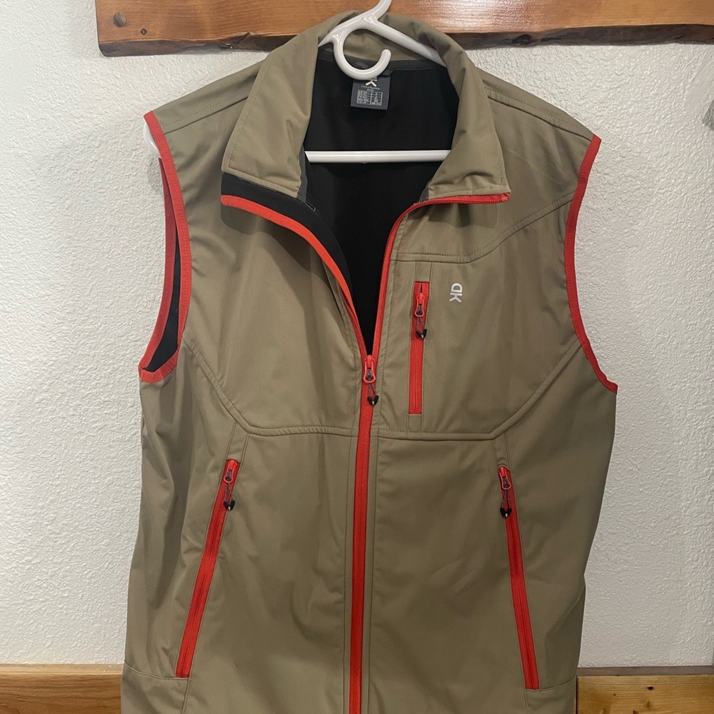 CK Tan and Red Vest